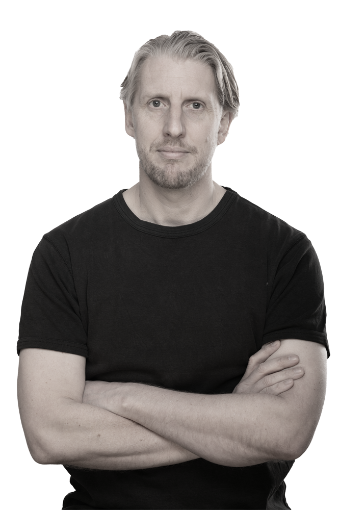 A head and shoulders shot of Jim Glodkowski wearing a black t-shirt
